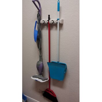 utility closet for brooms and mops